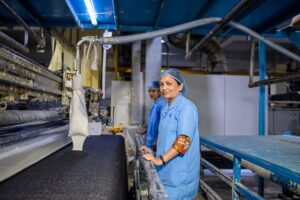 Food industry workwear being processed at a CanDo Laundry Services commercial laundry